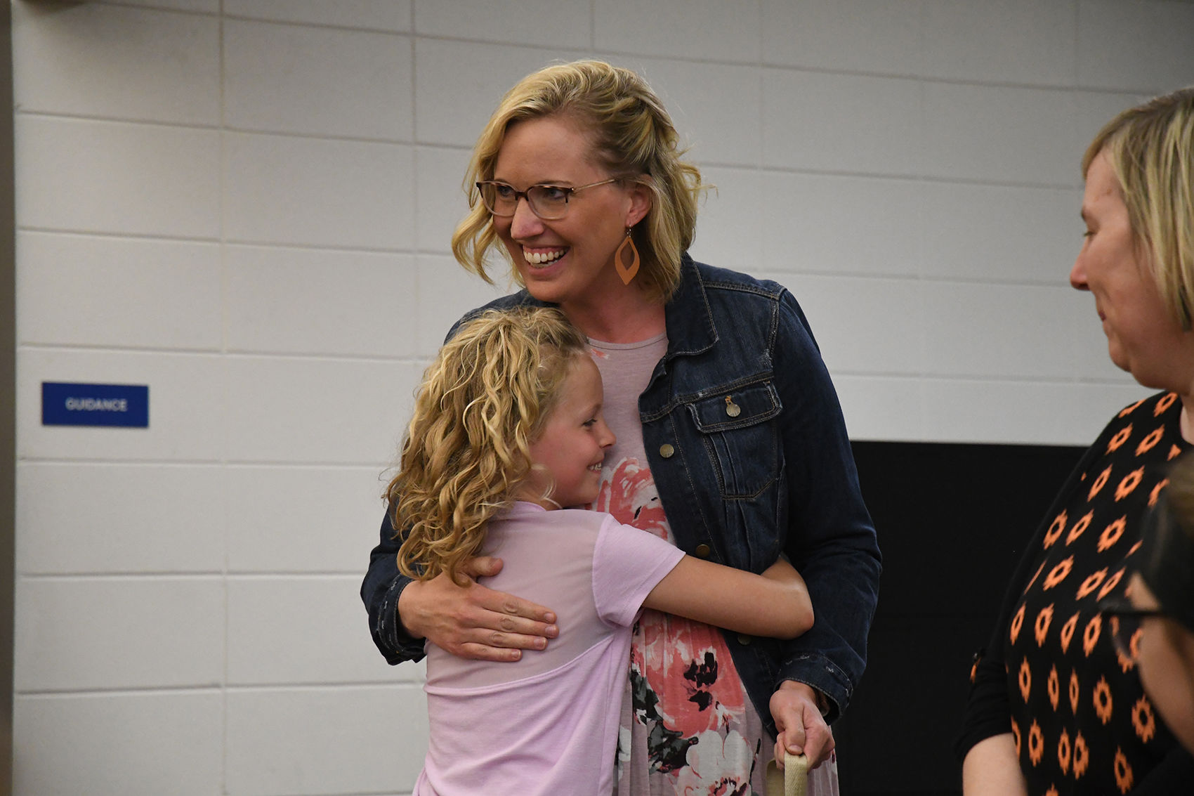 Bella Michels hugs her mom